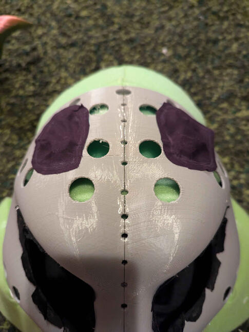 magnets are under the patches of fabric. LOTS of Hot glue holding this thing together.