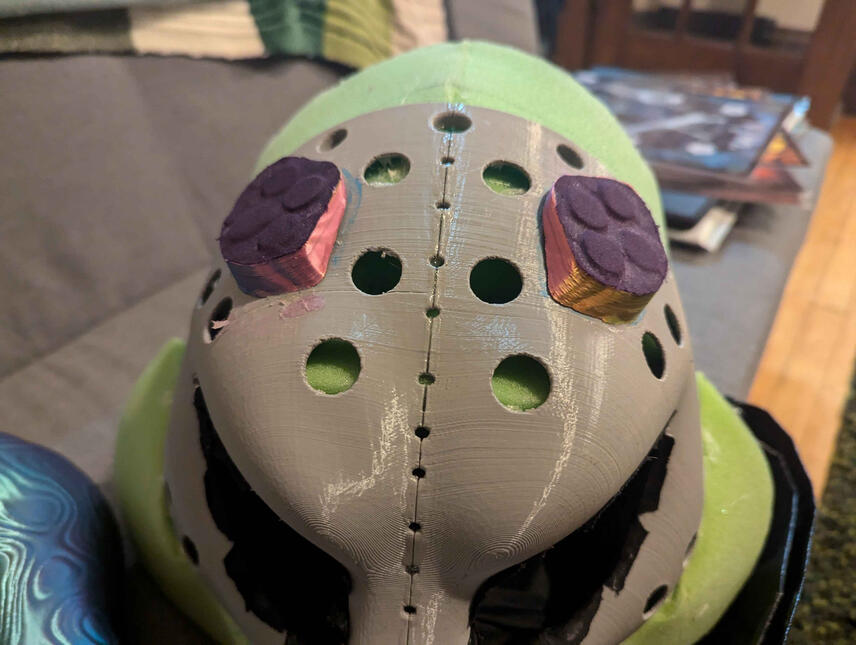 Horn bases secured to base, with fabric covering the magnet cavities.